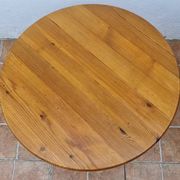 Scandinavian coffee table in solid pine with tripod legs in Swedish chalet style.