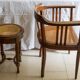 Antique armchair and stool with caned seat and fluted legs