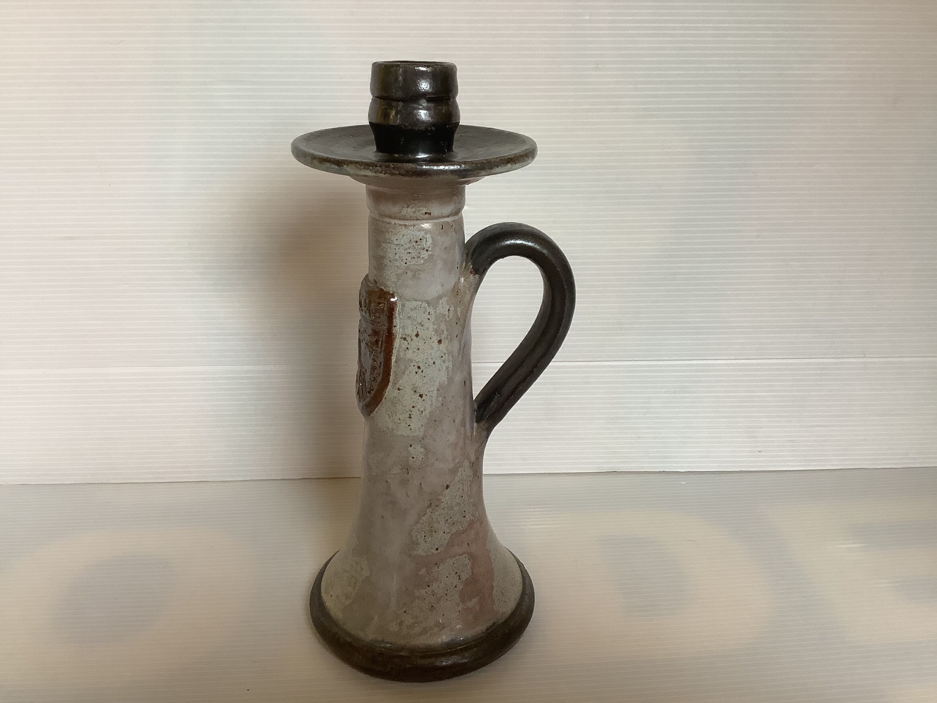 Bouffioulx style stoneware candle holder with a coat of arms