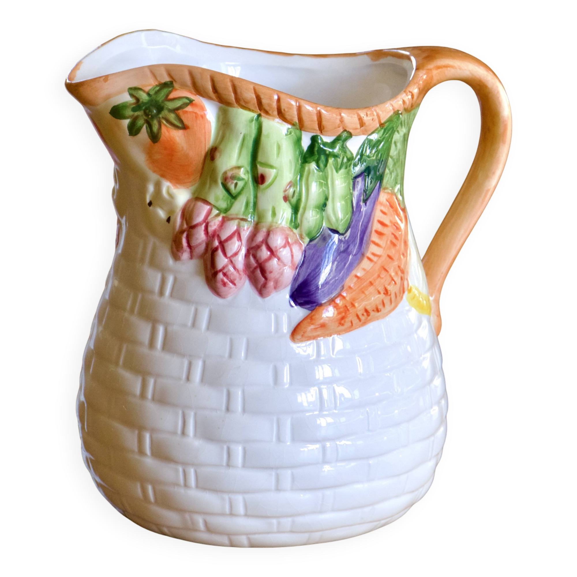 Hand-painted earthenware carafe with a raised vegetable basket design