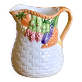 Hand-painted earthenware carafe with a raised vegetable basket design