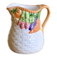 Hand-painted earthenware carafe with a raised vegetable basket design