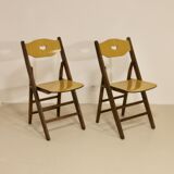 Pair of vintage folding chairs year 50 sculpted backrest.
