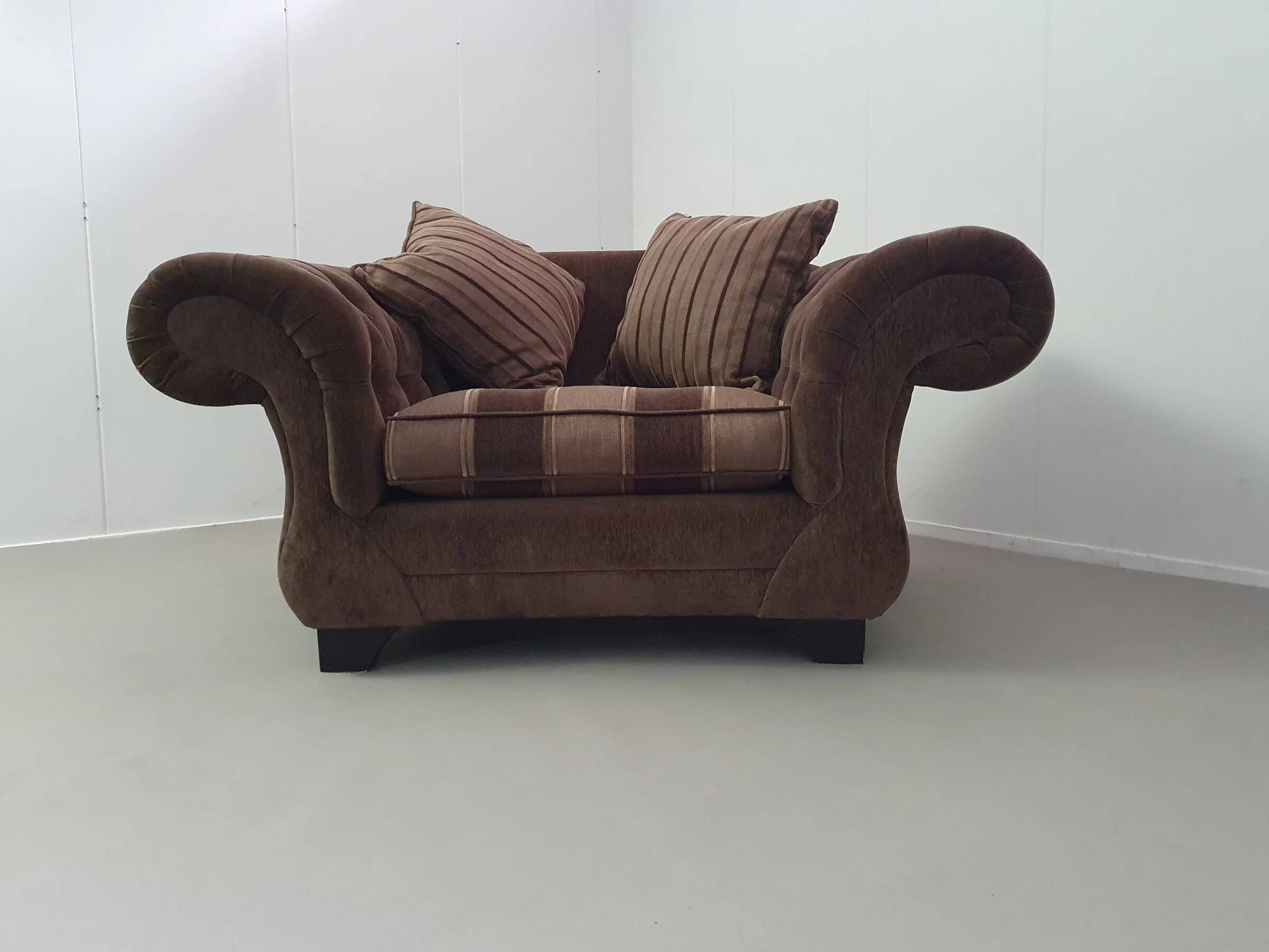 Large weighty love seat with the original matching cushions. Marked "Handmade in Holland"