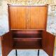 Storage cabinet with double compartment, metal feet circa 60's