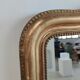 Louis Philippe gilded mirror with gendarme hat nineteenth H:130cm