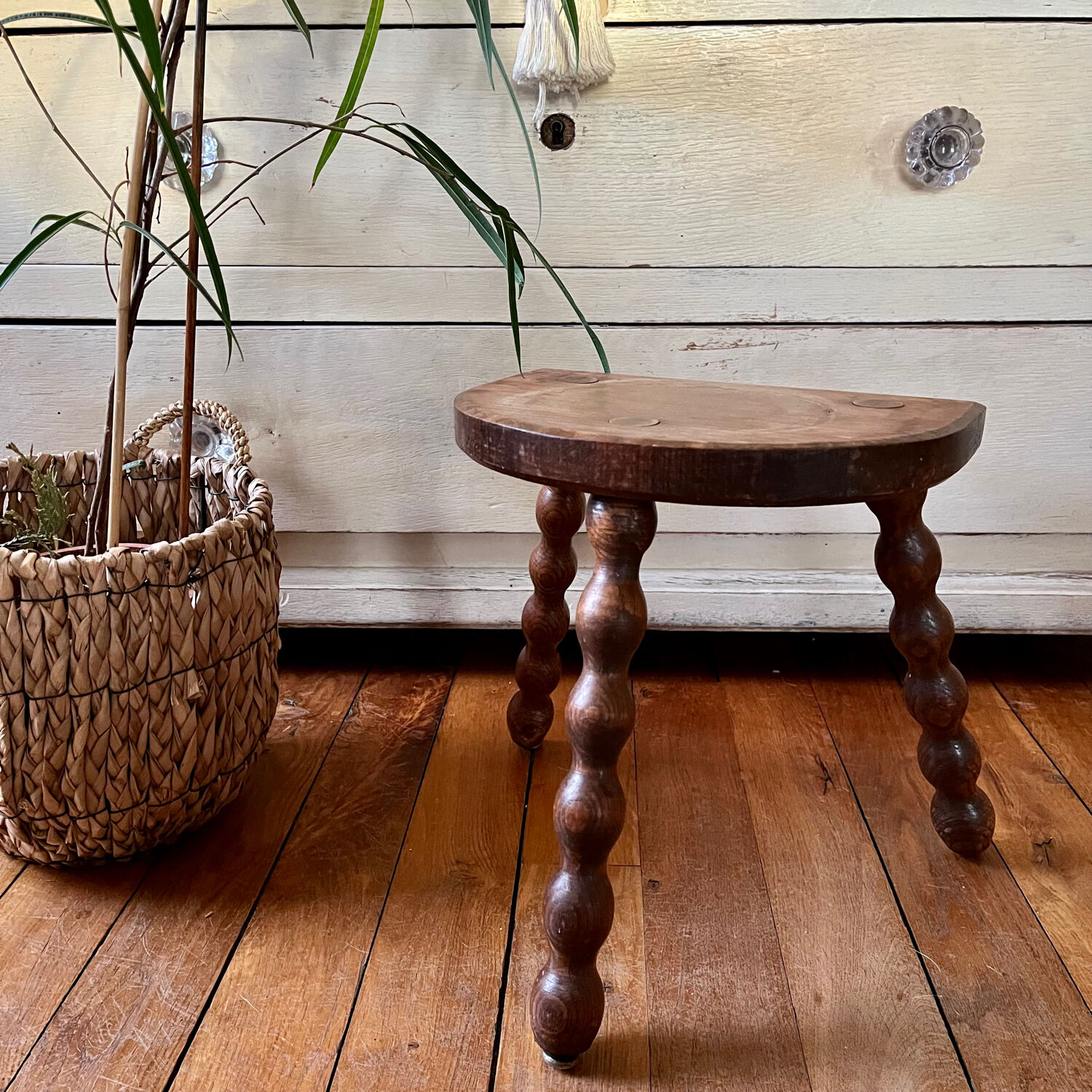 Low vintage wooden tripod stool