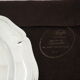 Round plate, Chinon collection with gold trim, Christofle, and its protective felt pouch.