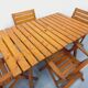 Salon de jardin vintage composé d’une table avec rallonges et 4 fauteuils