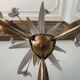 Golden metal chandelier decorated with flowers
