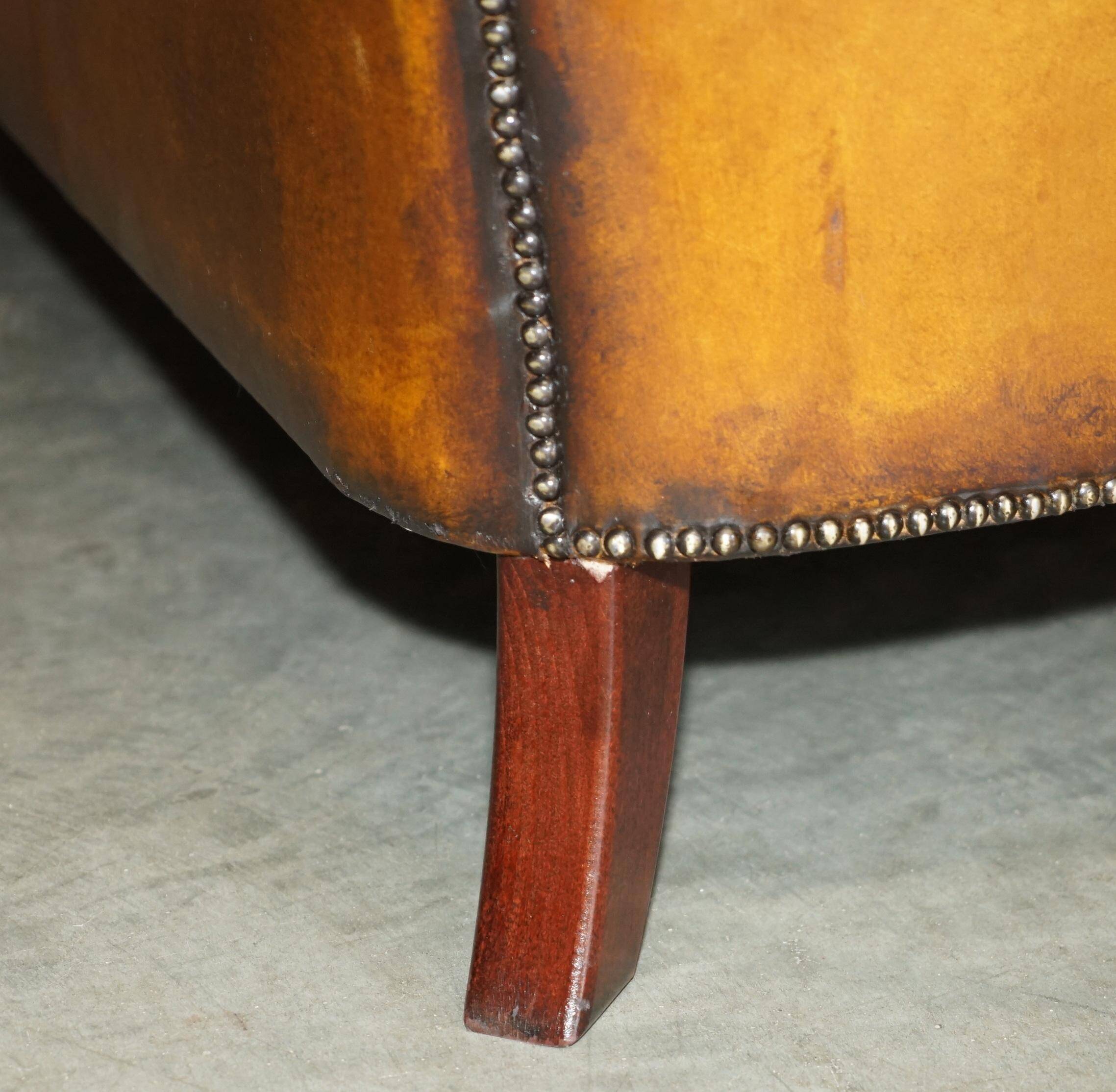 Vintage Chesterfield serpentine luxury sofa in restored leather