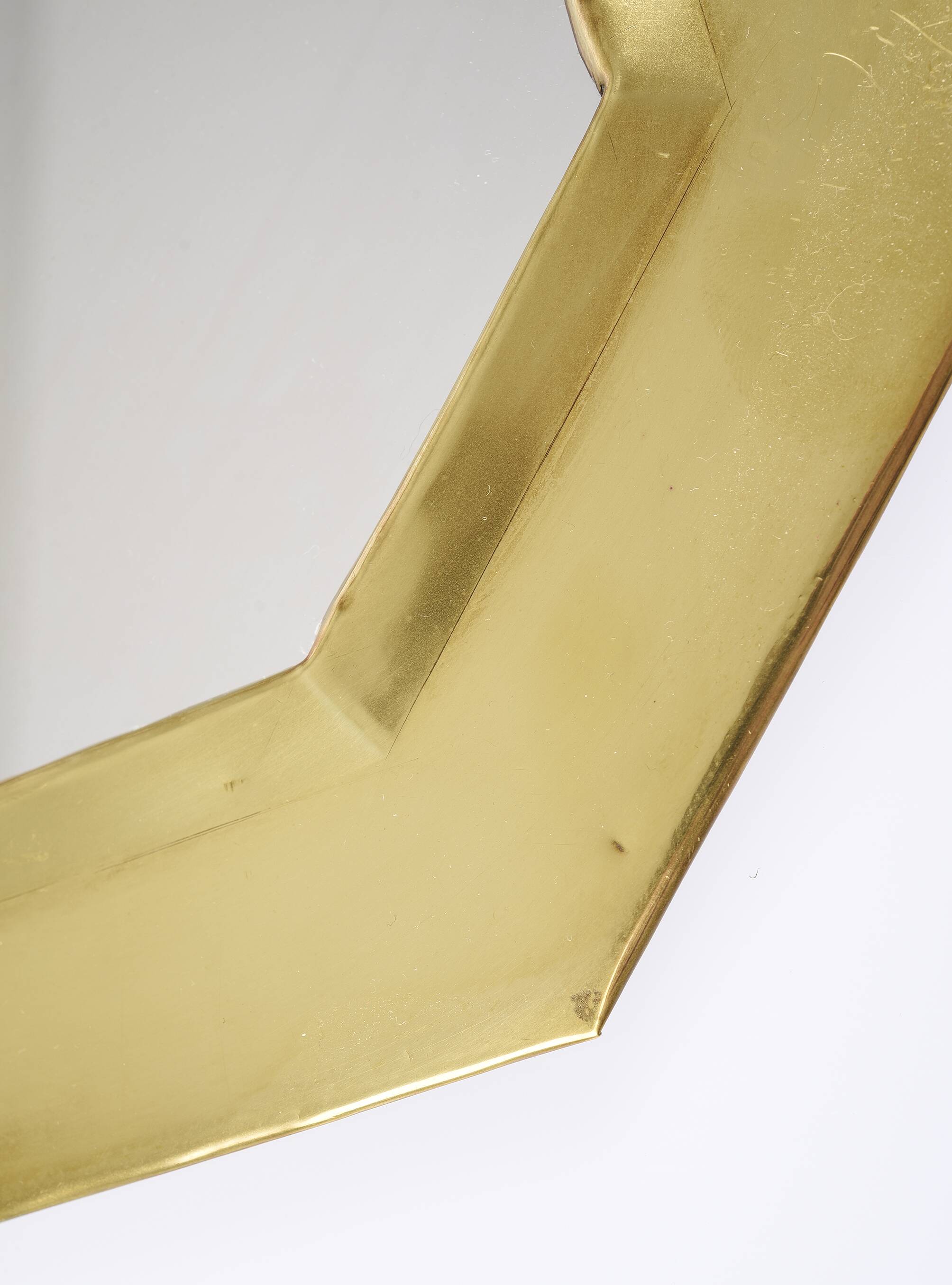 Old golden octagonal mirror, in brass