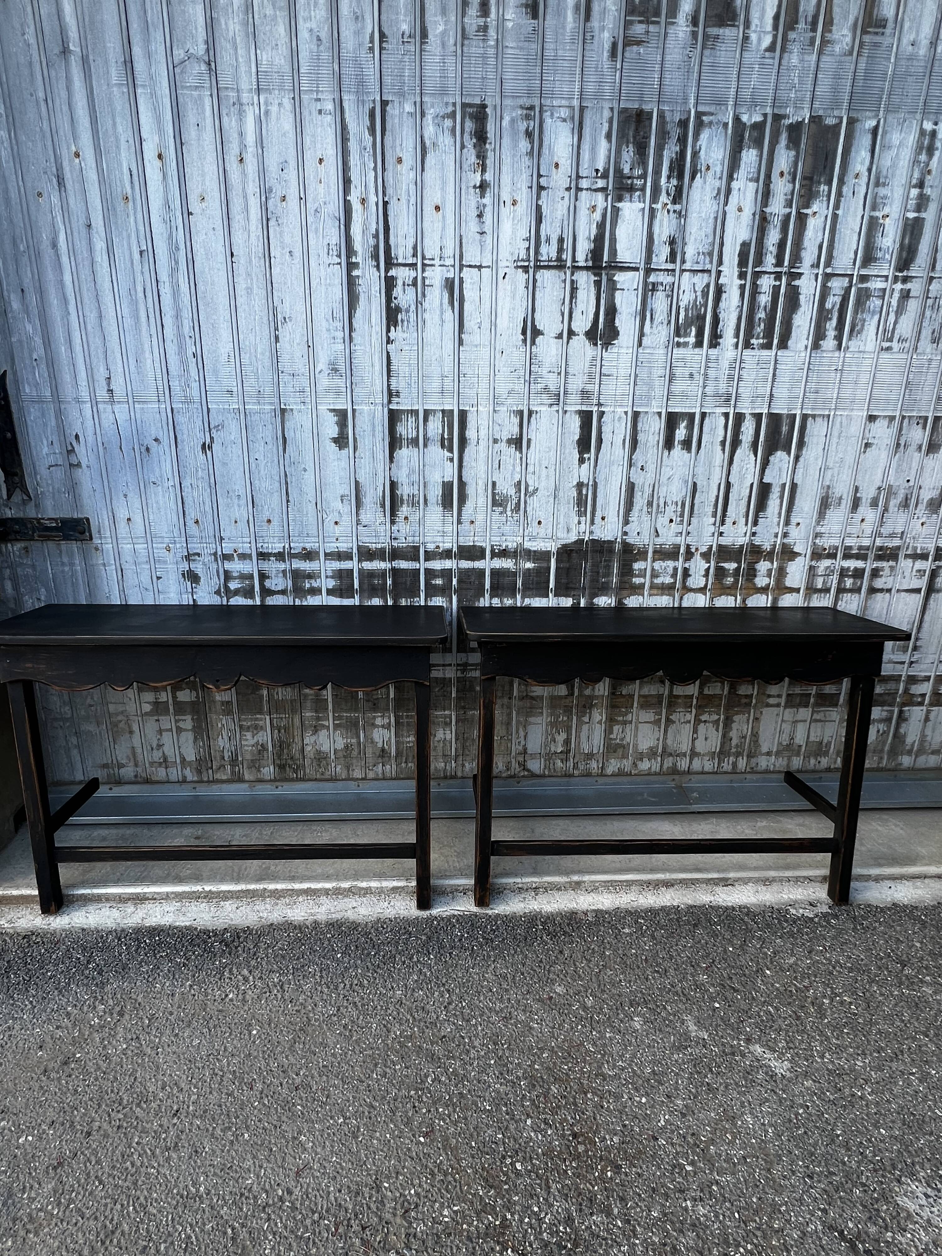 Pair of black patinated consoles