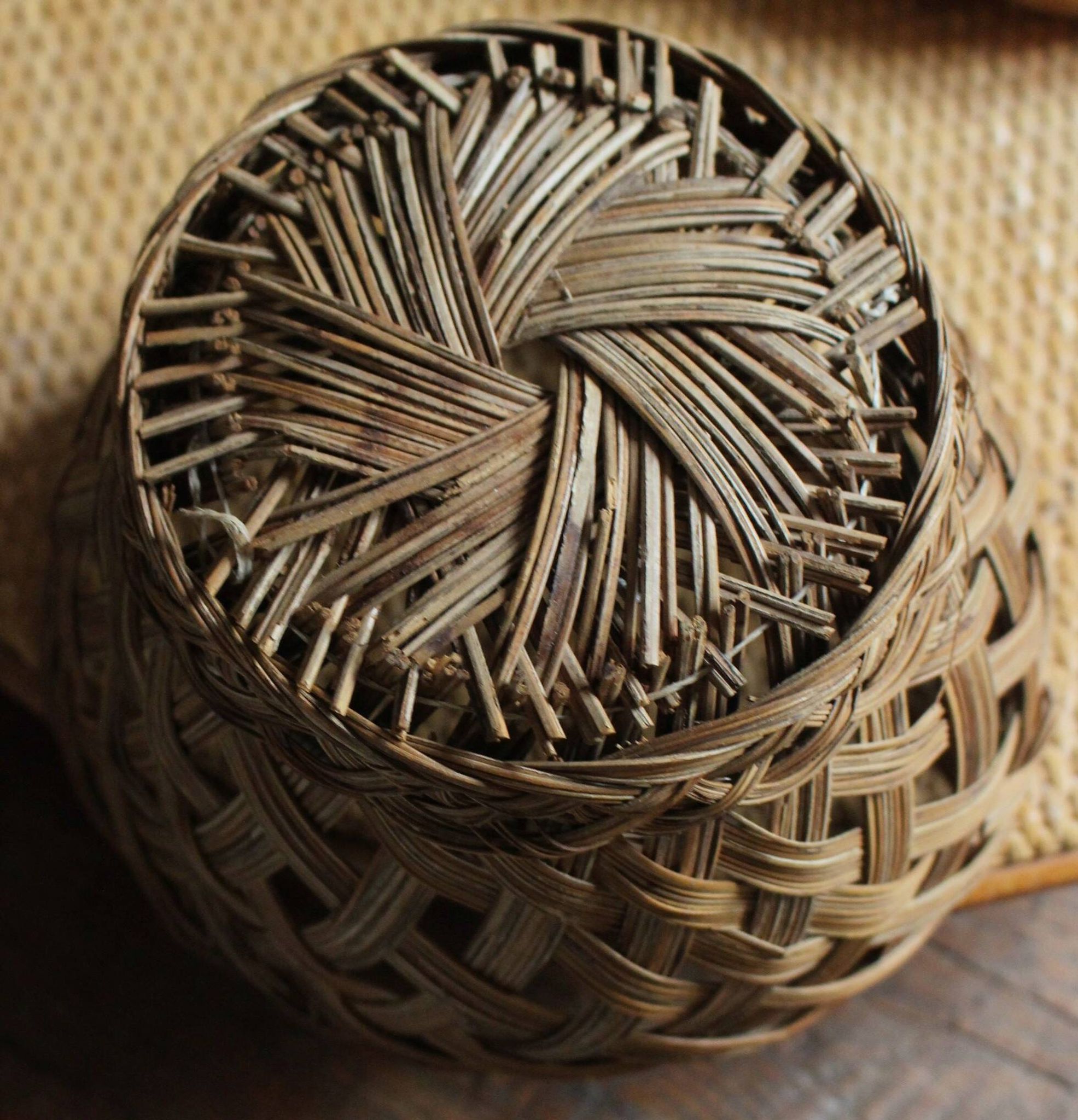 Vintage high round wicker basket with openwork.