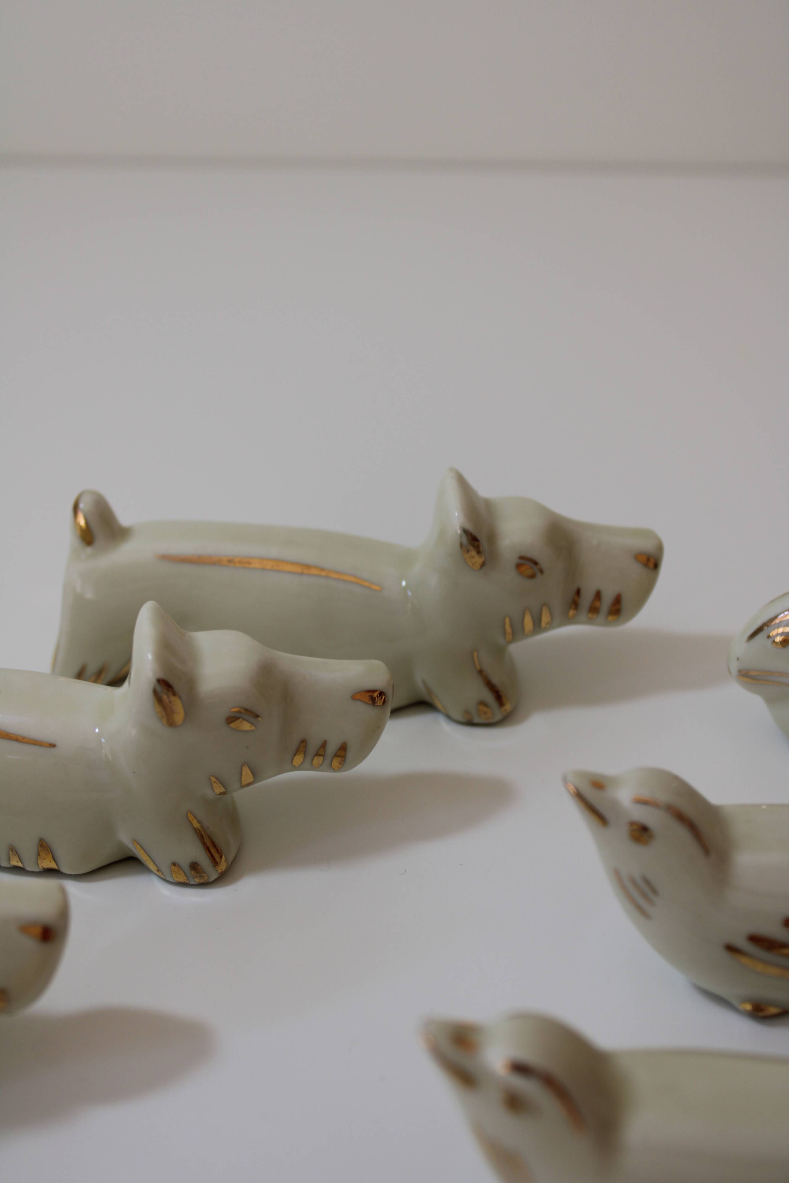 8 portes couteaux animaux porcelaine de Limoges vintage