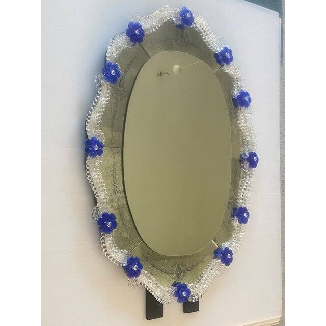 Early 21st century venetian oval floreal hand-carving mirror in murano glass