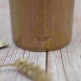 Small wooden sandstone bottle