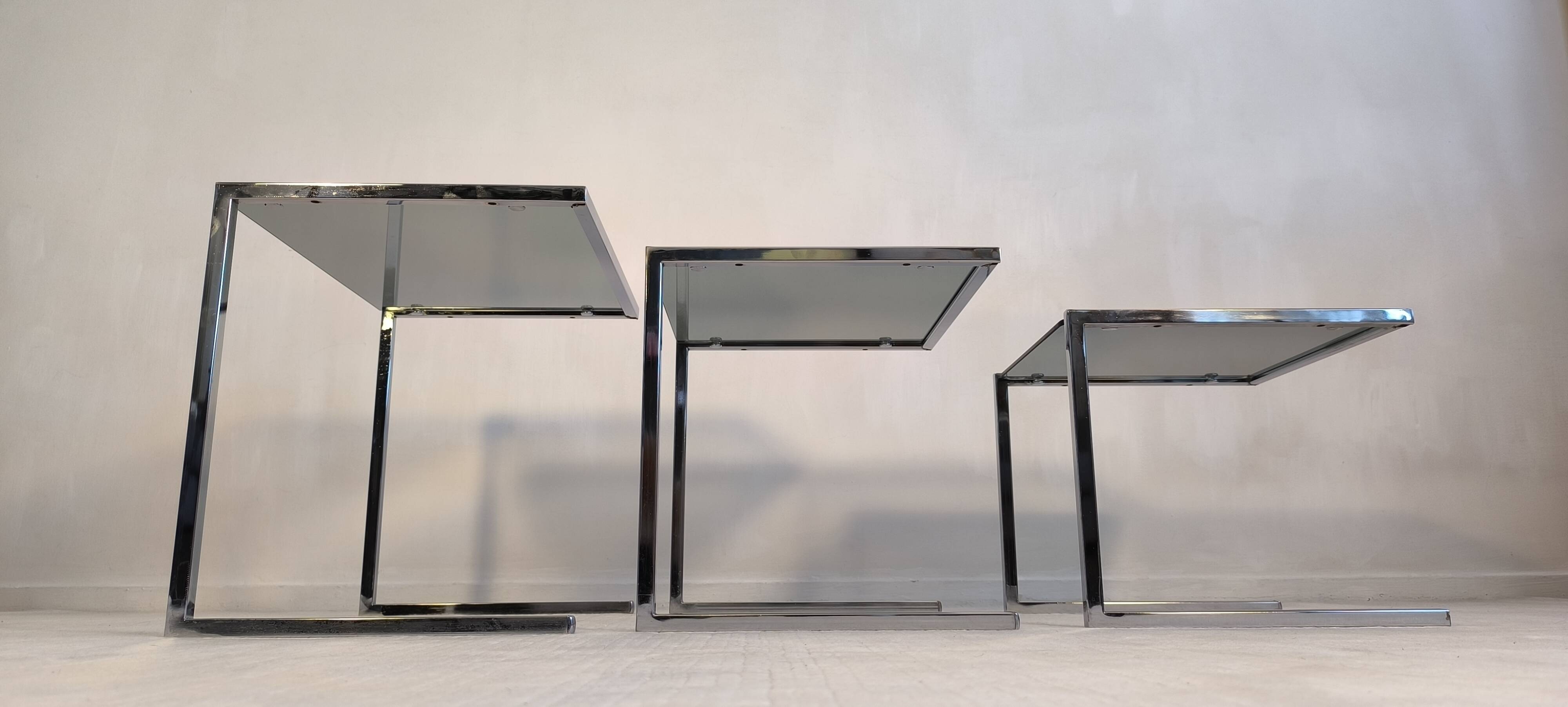 Set of 3 vintage nesting tables in chrome and smoked glass, Roche Bobois style.