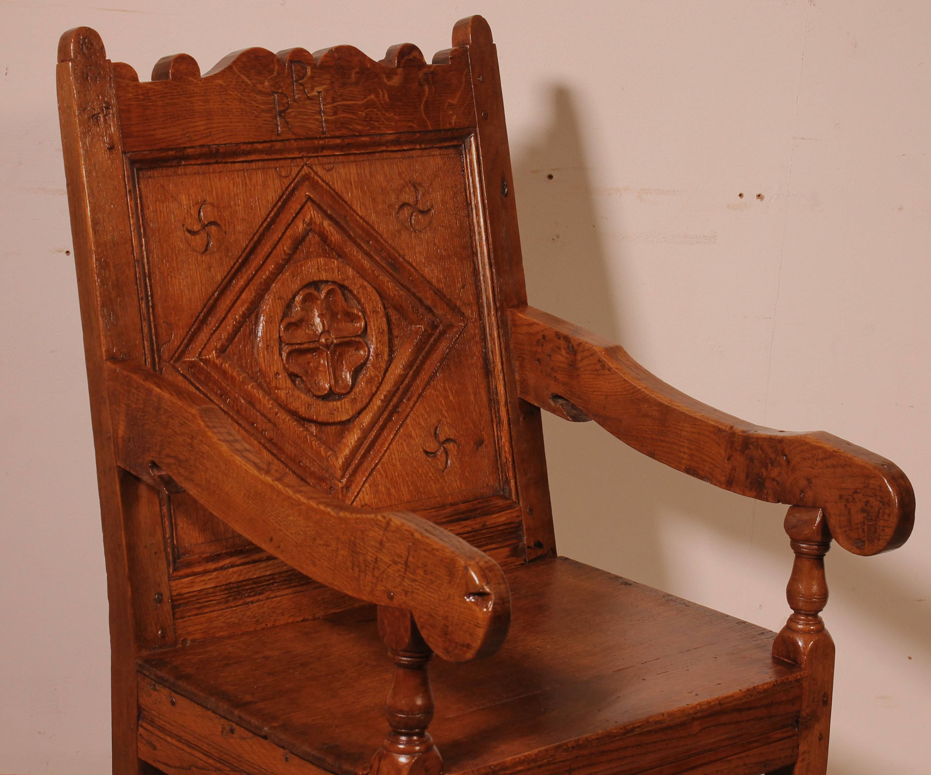 high-backed armchair from the 17th century in oak