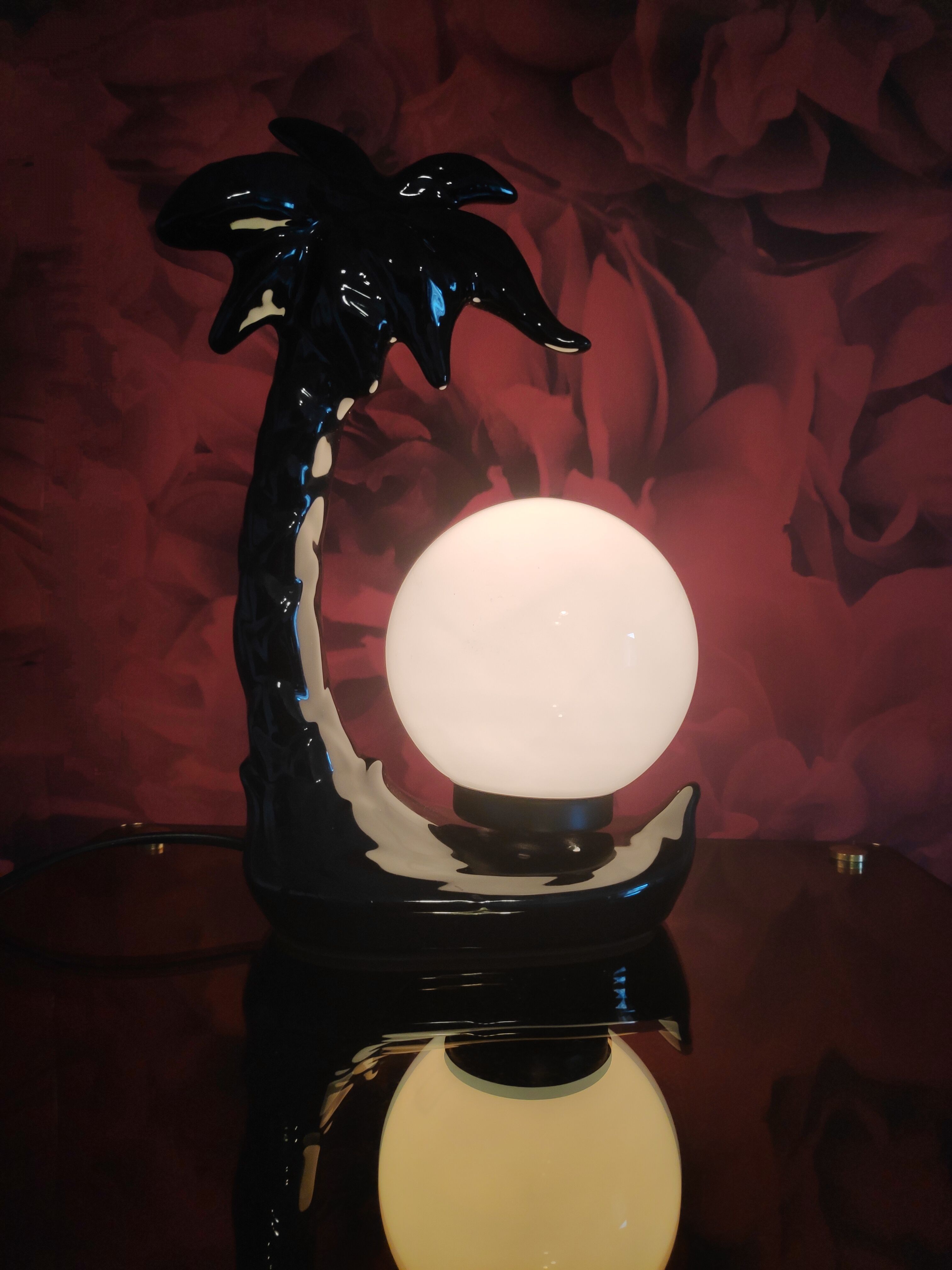 Black ceramic palm lamp and white opaline globe
