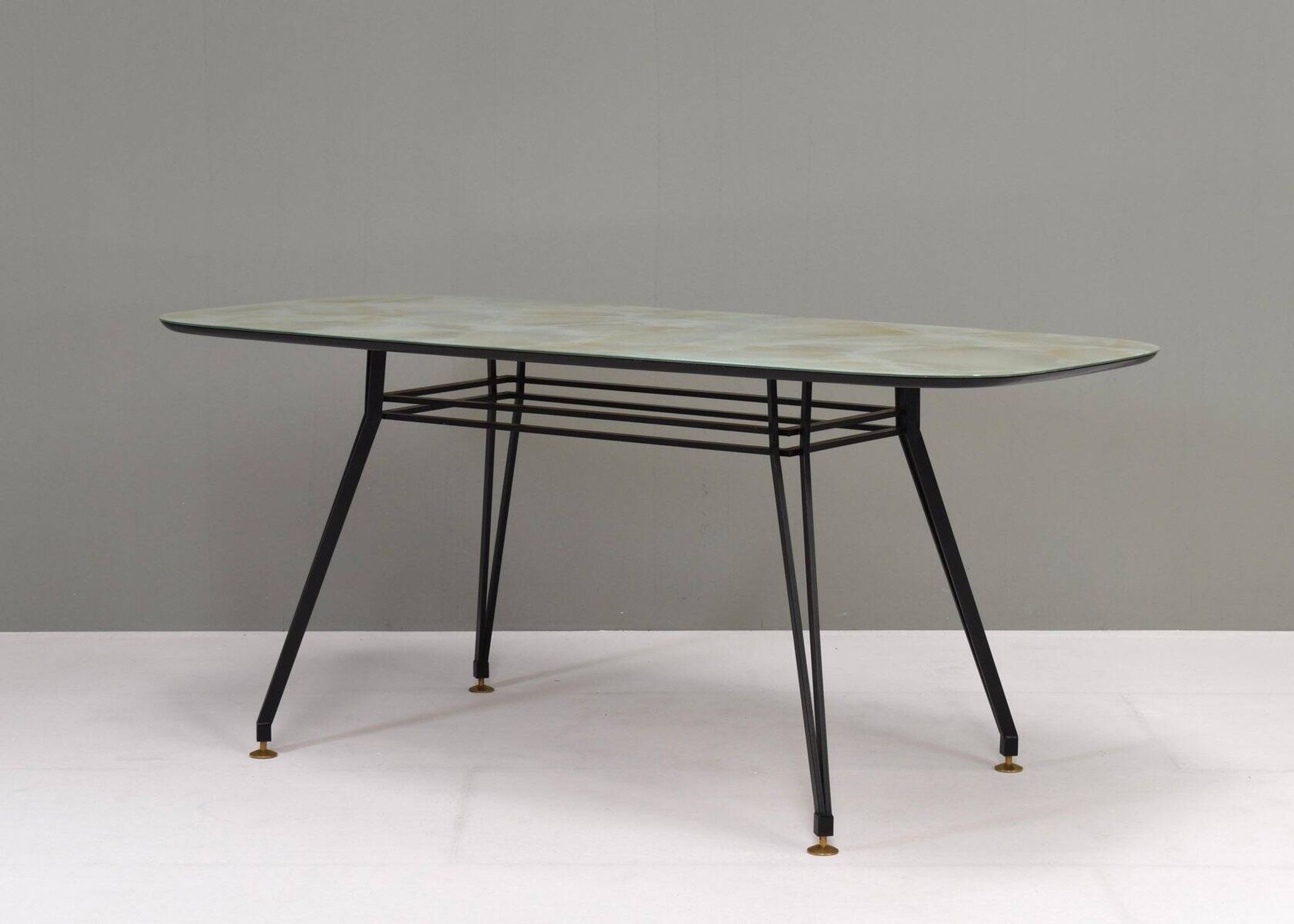 Italian dining table with metal base and glass top and brass, 1950s