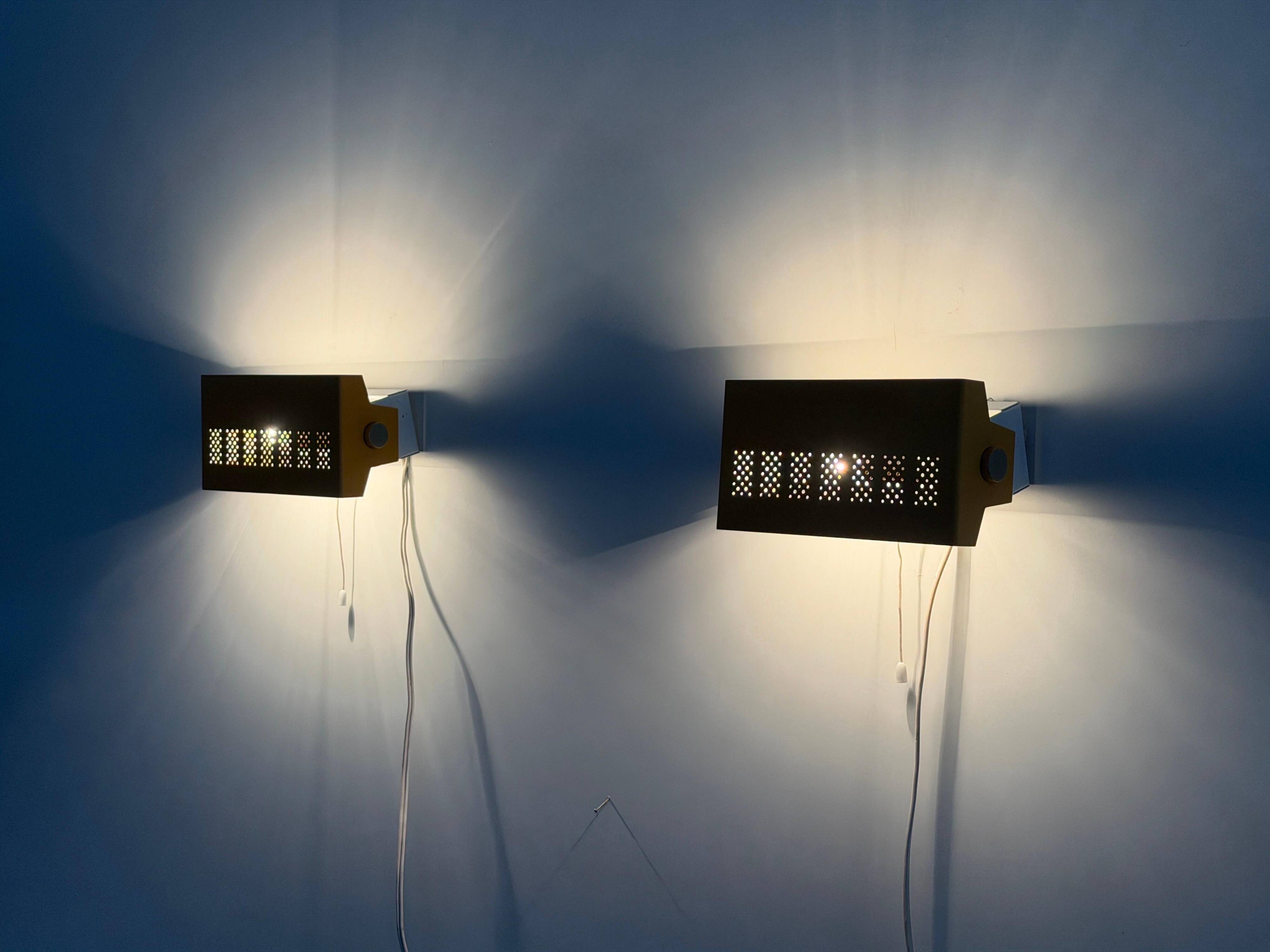 Pair of yellow metal wall lights from the mid-century by N Leuchten, 1960s, Germany.