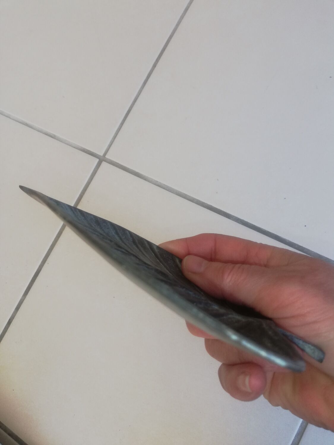 Greenish metal leaf pocket emptier