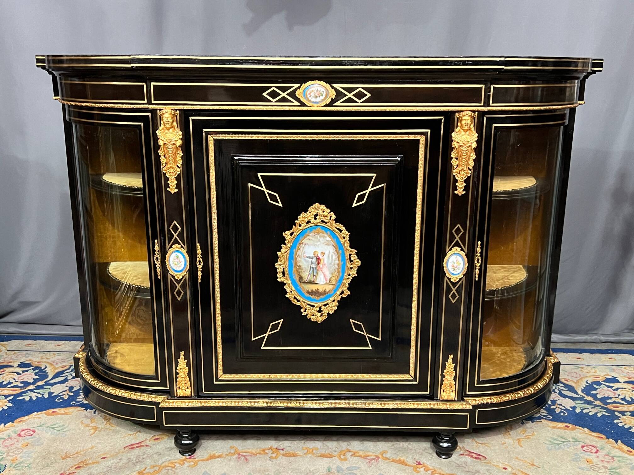Napoleon III style credenza with four Sèvres medallions.