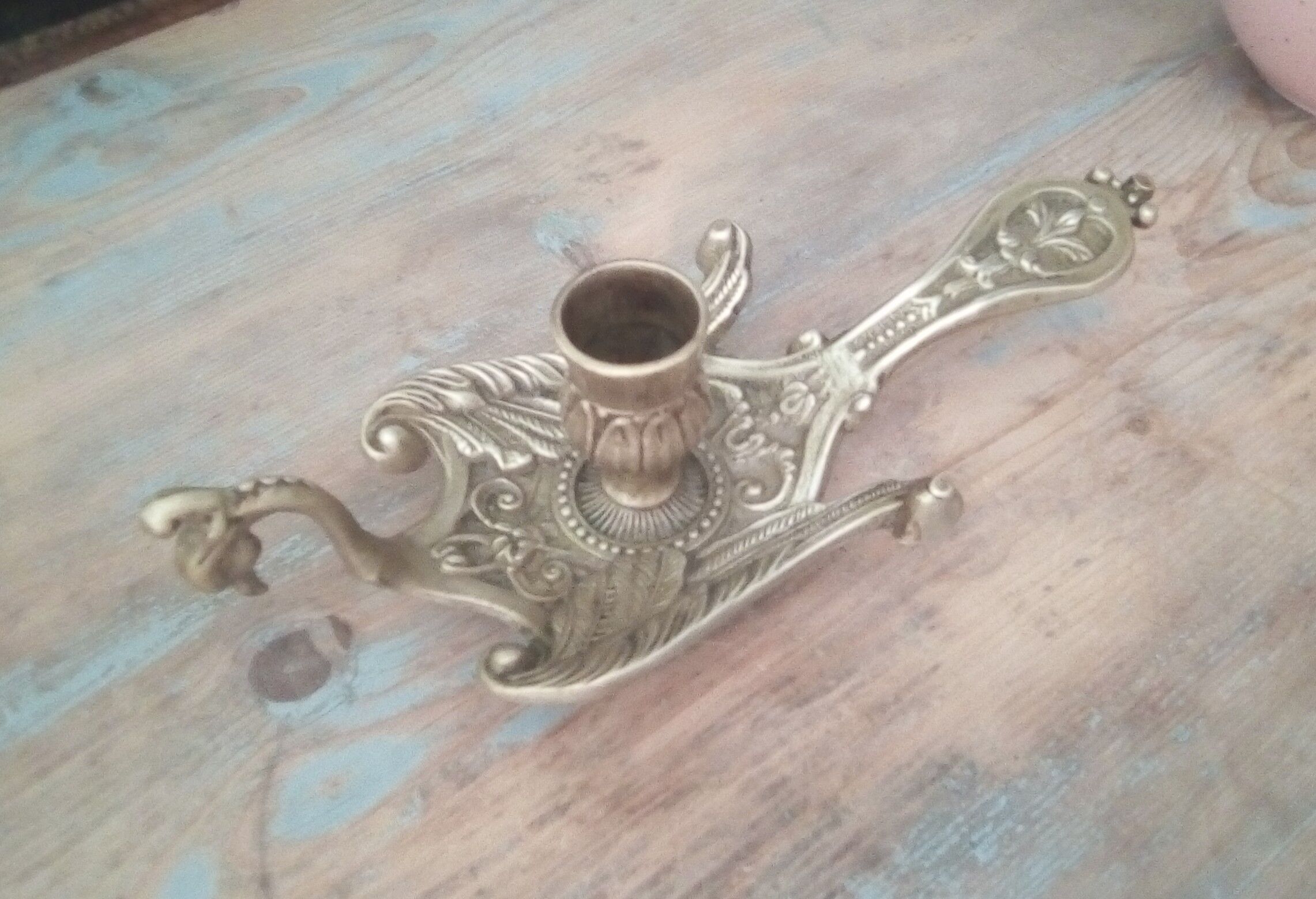 Old hand candlestick in chissed solid brass