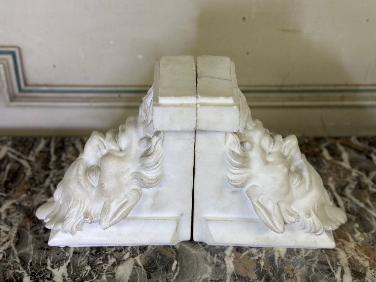 Pair of white statuary marble consoles, with faun heads