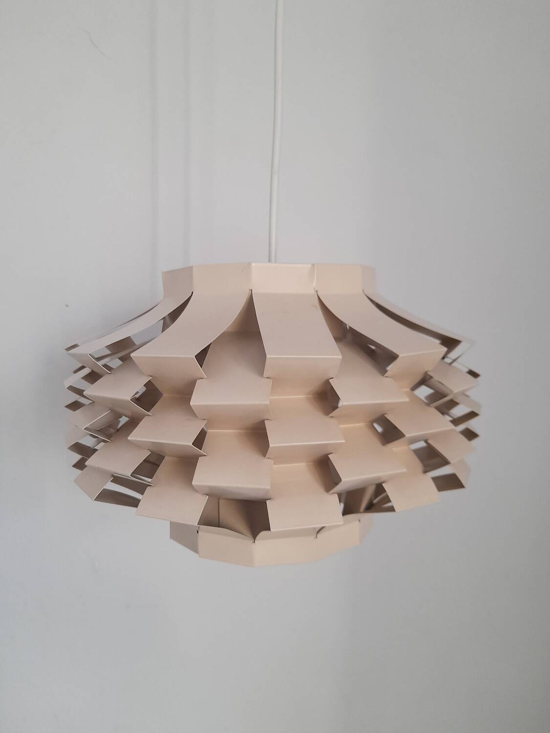 Beige metal pendant from the 1950s or 1960s.