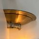 Pair of Art Deco corner sconces, brass and glass, France 1930