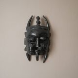 Decorative mask hand carved in tribal ethnic painted wood