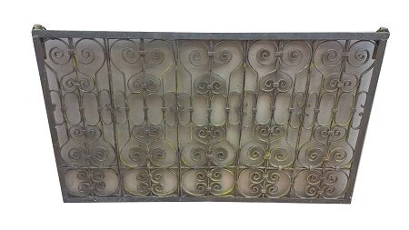 Old wrought iron railing with mirror and teak frame