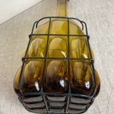 Glass carafe encased in wrought iron