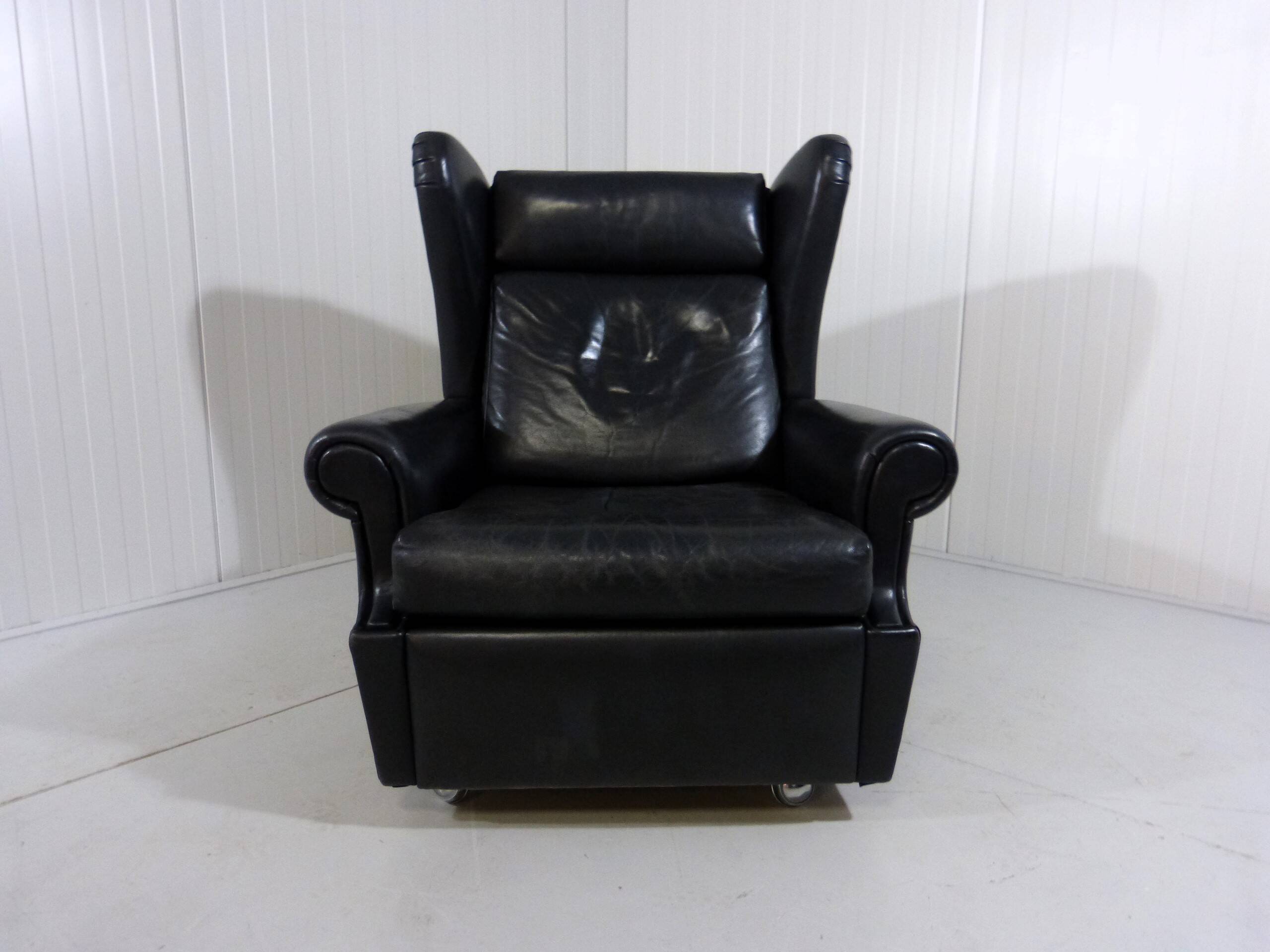 Black leather wingback chair on wheels 1960’s