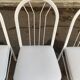 4 chaises en acier blanc et cuir gris