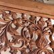 Very large freestanding teak mirror with an openwork carved pediment, Indonesia.