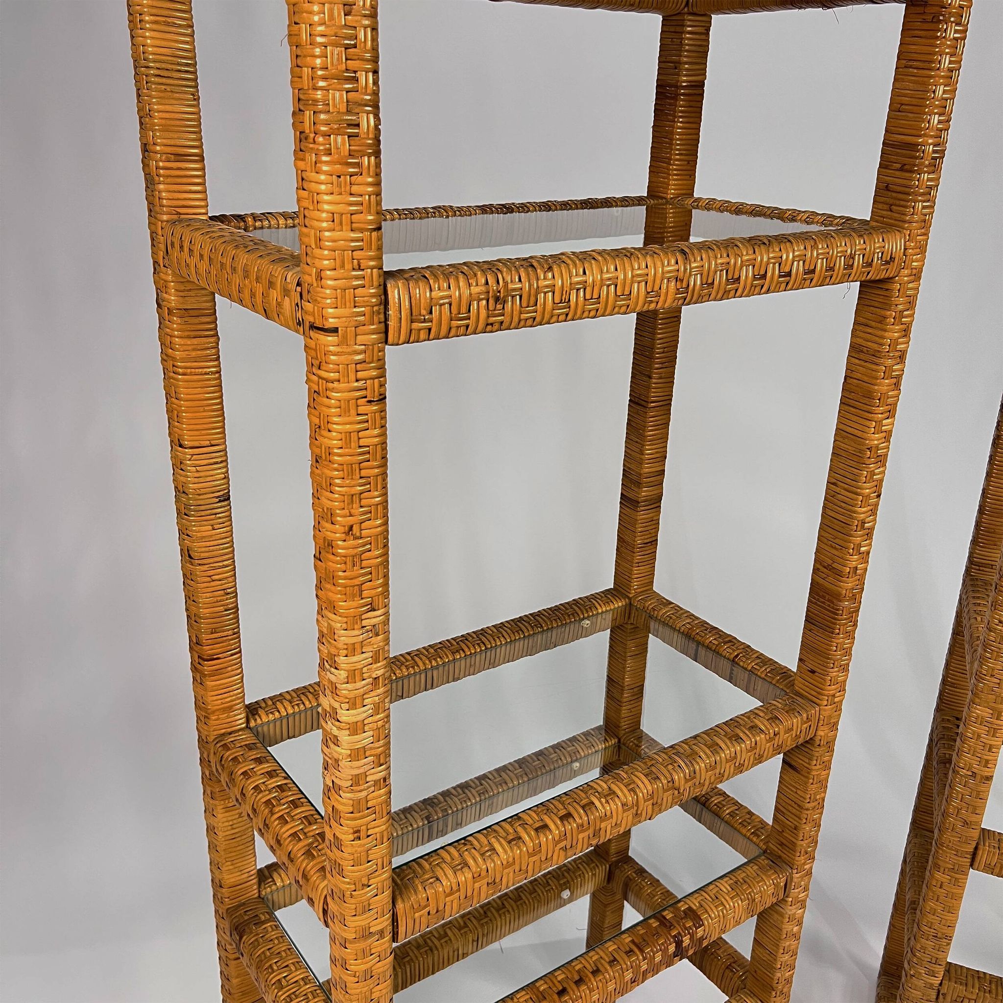 Set of 2 mid century tall wicker and glass etagere cabinet, 1970s