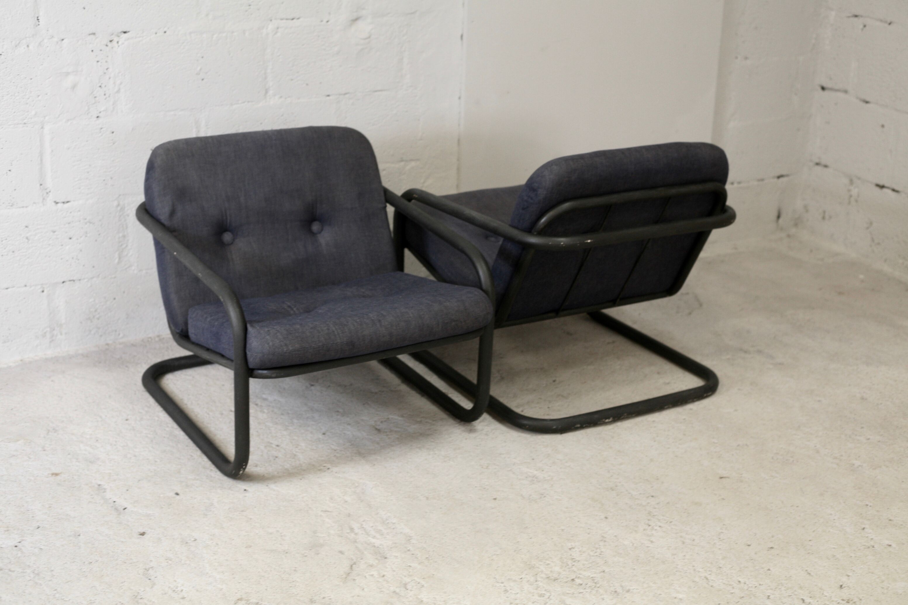 Pair of Prisunic edition armchairs, tubular steel and foam cushions, France, 1973