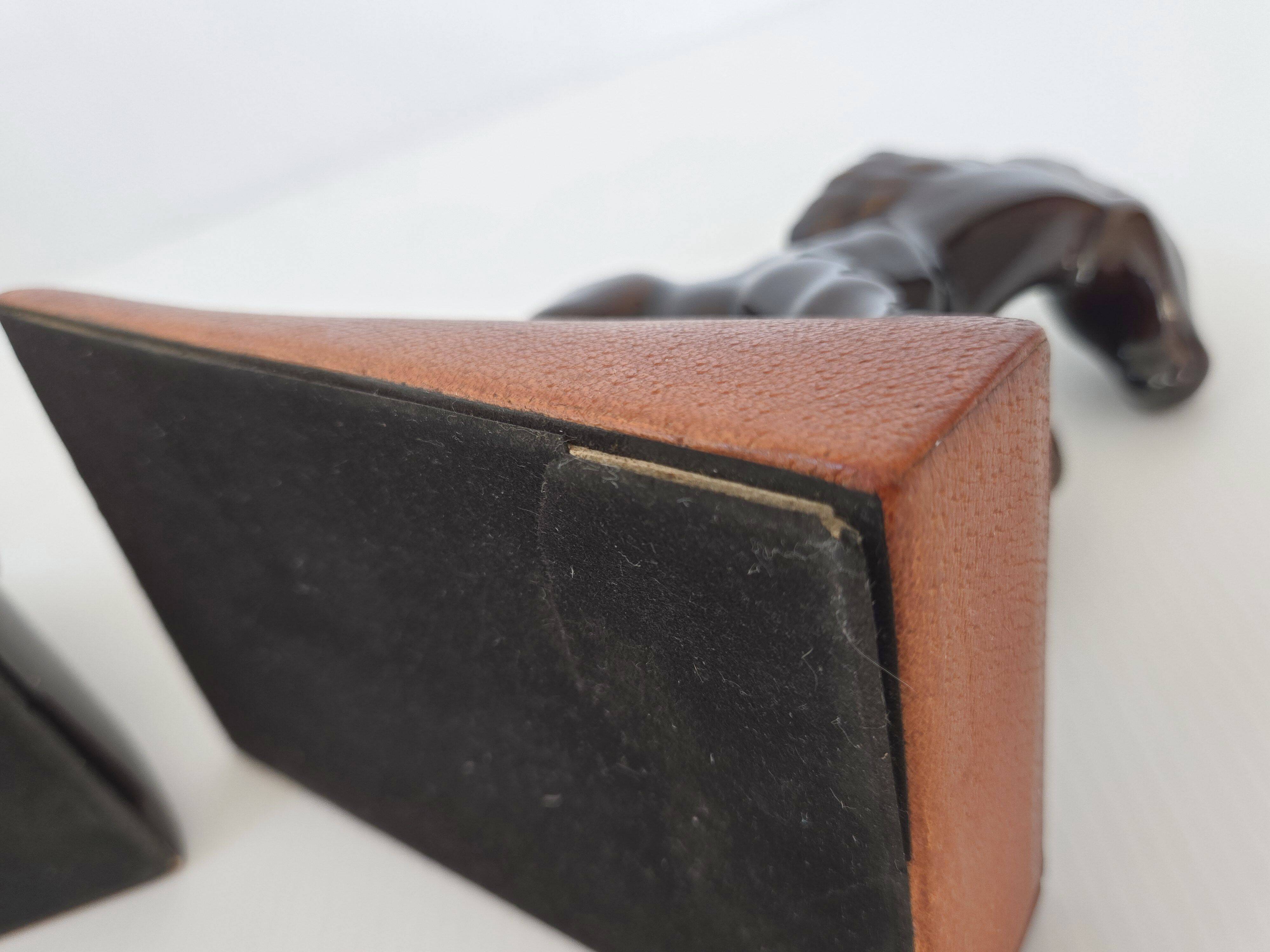 Pair of vintage leather & ceramic bookends