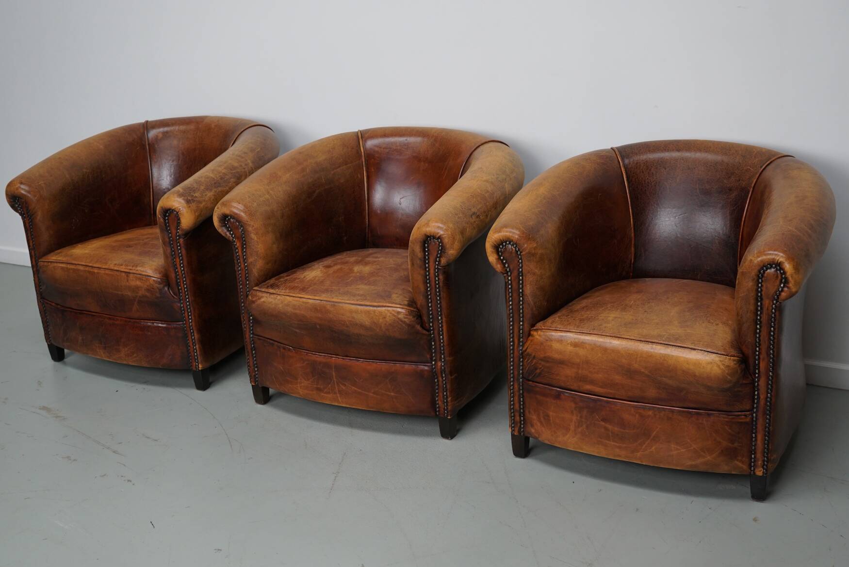 Fauteuils club vintage hollandais en cuir cognac, lot de trois