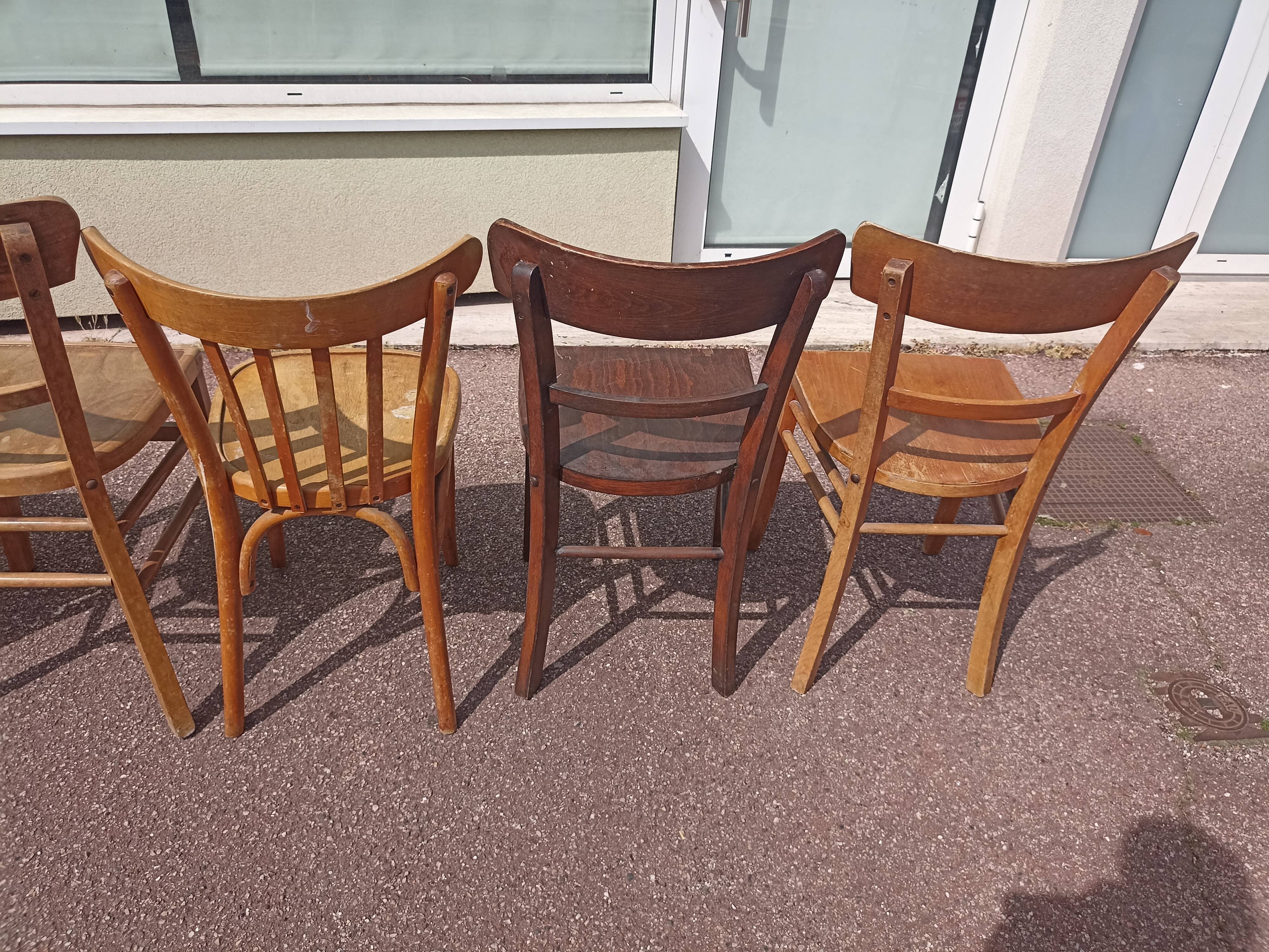 Set of 12 mismatched wooden bistro chairs
