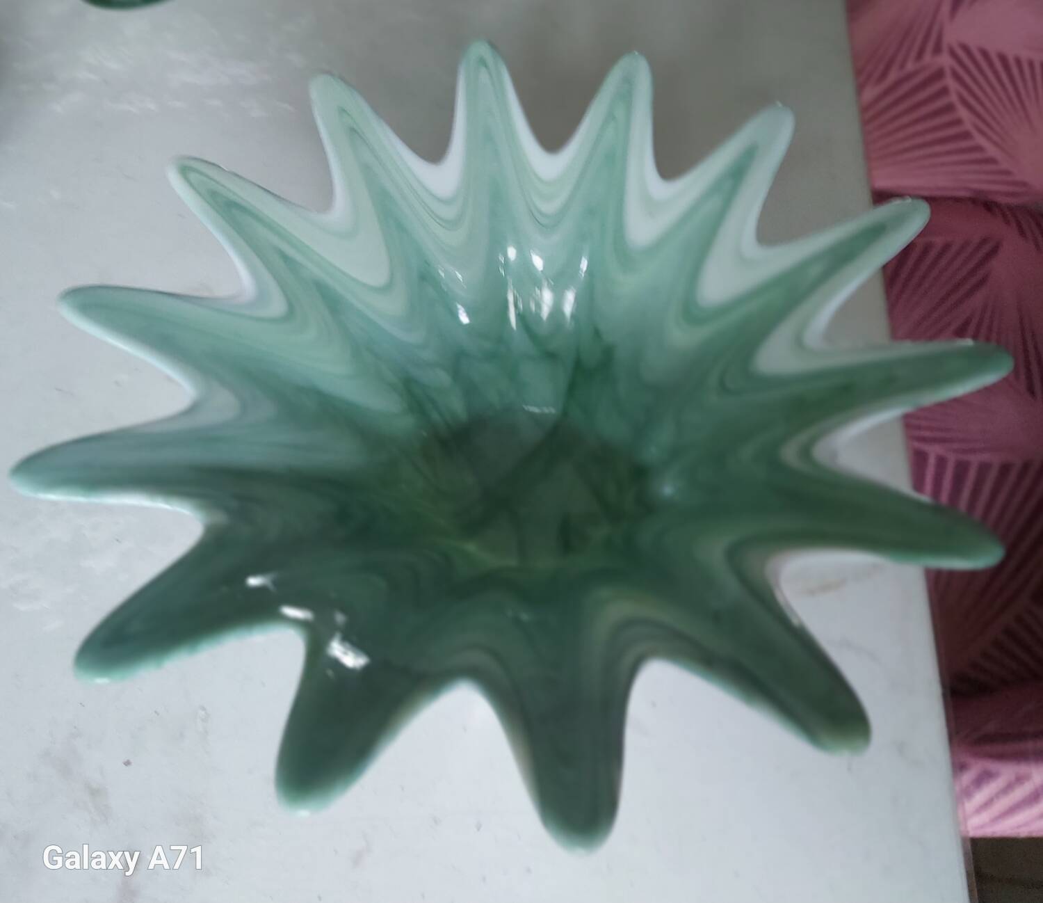 Opalescent glass bowl in the Murano style with a silver-plated metal base.