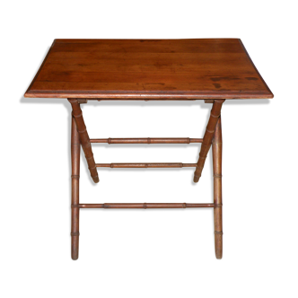 Table pliante époque 1900 en bois, imitation bambou en belle état..