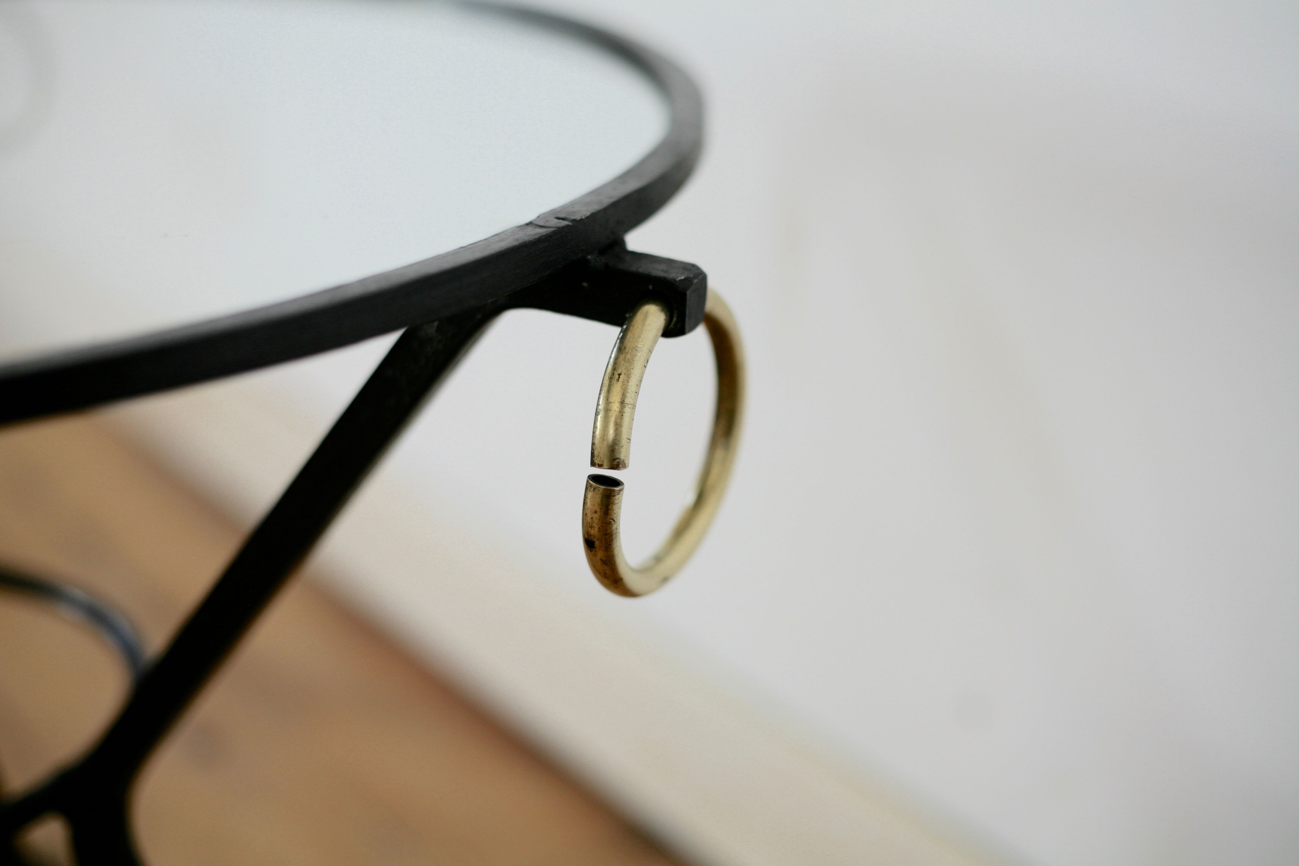 Coffee table black lacquered metal, glass and brass, France, circa 1950.
