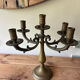 Pair of large 5-light candlesticks in patinated brass, classical style.