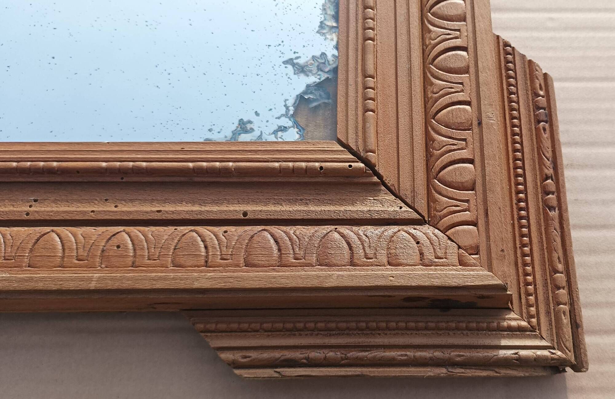 Louis XVI mirror in carved wood, 19th century.