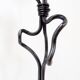 Large wrought iron candelabrum with an abstract design and three candle holders.