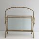 Bamboo-style brass magazine rack from the Baguès house.